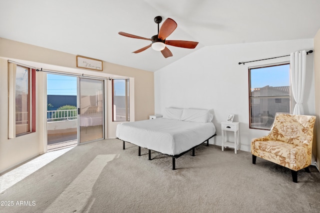 carpeted bedroom with ceiling fan, access to outside, and vaulted ceiling