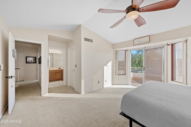 bedroom with vaulted ceiling, ceiling fan, access to exterior, connected bathroom, and light colored carpet