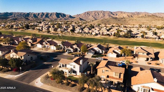 birds eye view of property with a mountain view