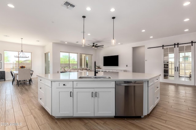 6356 S Granite St, Gilbert, AZ 85298 - kitchen featuring stainless steel dishwasher, a sink, open floor plan, white cabinetry, and recessed lighting