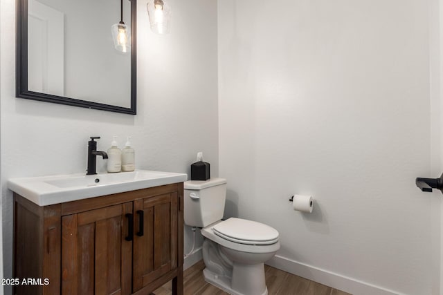 6356 S Granite St, Gilbert, AZ 85298 - bathroom featuring toilet, wood finished floors, vanity, and baseboards