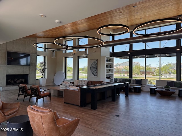 6356 S Granite St, Gilbert, AZ 85298 - living area with a towering ceiling, wood finished floors, a high end fireplace, and recessed lighting