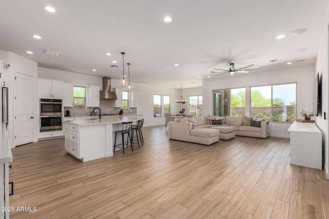 6356 S Granite St, Gilbert, AZ 85298 - living room with recessed lighting, a ceiling fan, and light wood-style floors