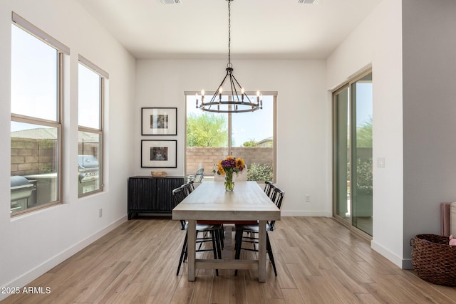 6356 S Granite St, Gilbert, AZ 85298 - dining area with light wood-style floors, a chandelier, and baseboards