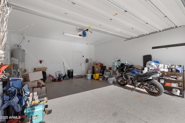 garage with water heater and a garage door opener