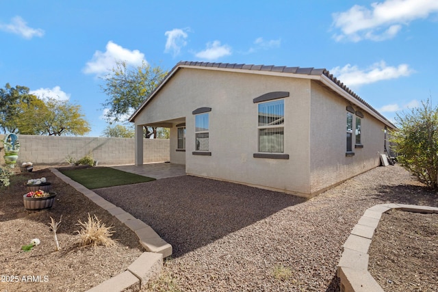 back of property featuring a patio area