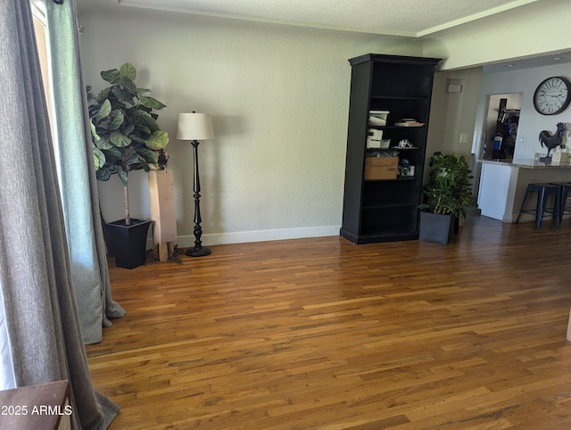 living room with dark hardwood / wood-style floors and a textured ceiling