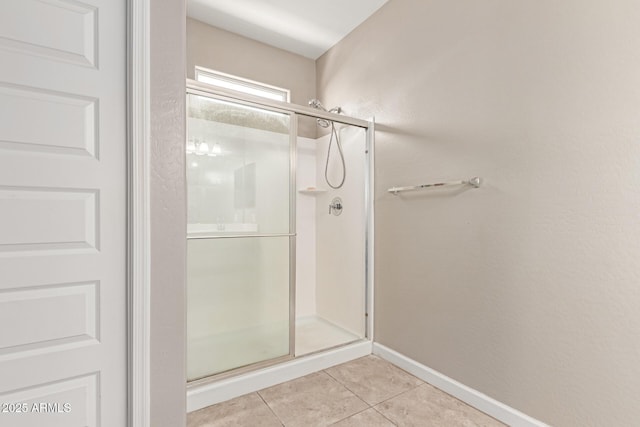 18800 W Madison St, Buckeye, AZ 85326 - full bath with tile patterned flooring, a shower stall, and baseboards