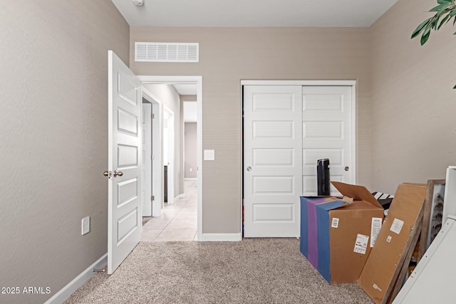 18800 W Madison St, Buckeye, AZ 85326 - interior space featuring baseboards, visible vents, a closet, and light colored carpet
