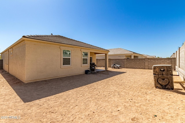 18800 W Madison St, Buckeye, AZ 85326 - back of house featuring a fenced backyard, a patio, and stucco siding