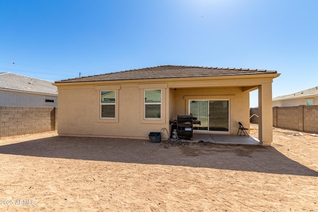 18800 W Madison St, Buckeye, AZ 85326 - back of house featuring a patio area, a fenced backyard, and stucco siding