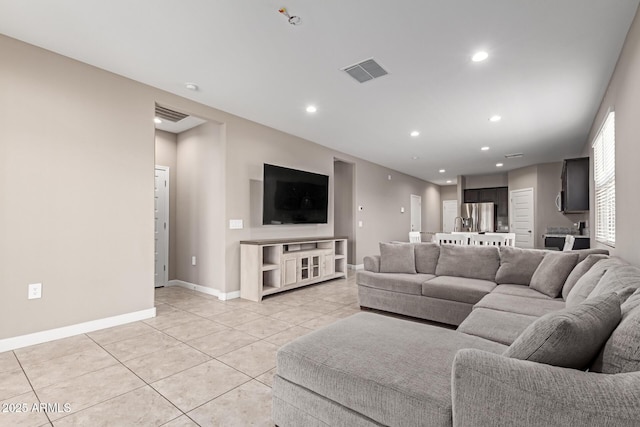18800 W Madison St, Buckeye, AZ 85326 - living room featuring recessed lighting, visible vents, baseboards, and light tile patterned flooring
