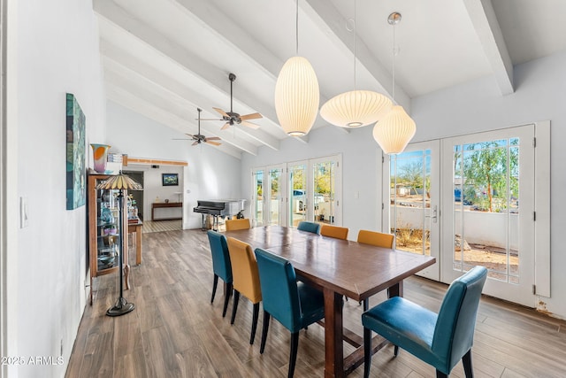 dining room with high vaulted ceiling, french doors, wood finished floors, and beam ceiling