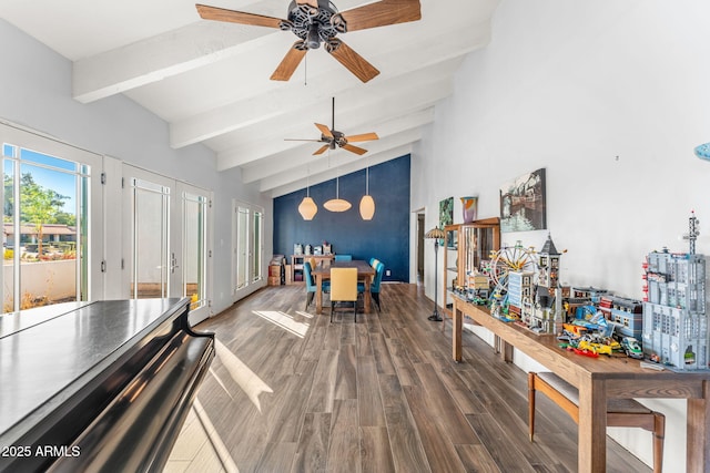 interior space featuring vaulted ceiling with beams and wood finished floors