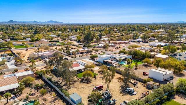 birds eye view of property with a mountain view