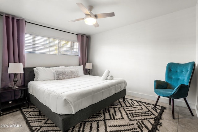 tiled bedroom with ceiling fan