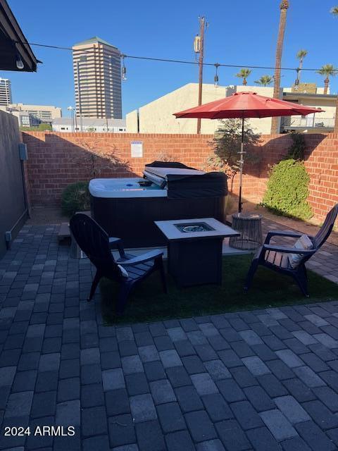 view of patio featuring an outdoor fire pit