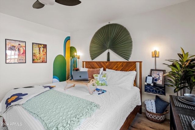 bedroom featuring hardwood / wood-style flooring and ceiling fan