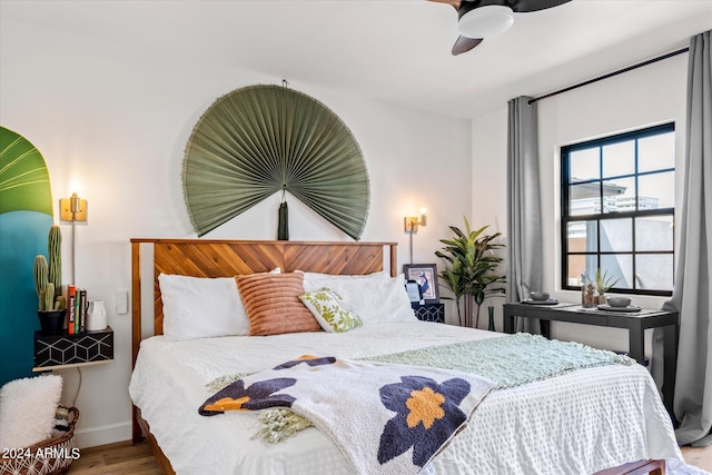 bedroom featuring wood-type flooring and ceiling fan