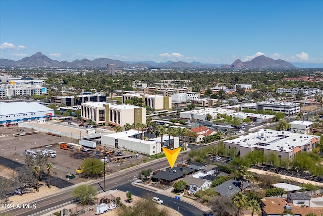 birds eye view of property with a mountain view