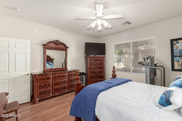 bedroom with ceiling fan and hardwood / wood-style flooring