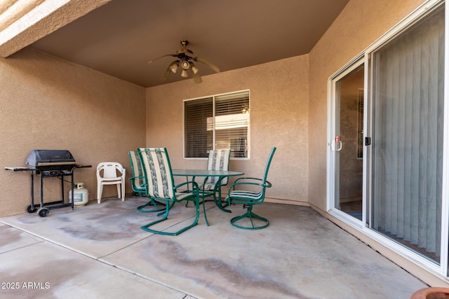 view of patio featuring grilling area and ceiling fan