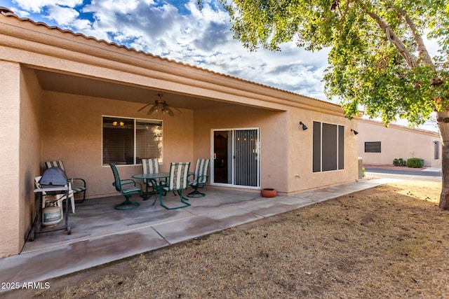 exterior space featuring ceiling fan