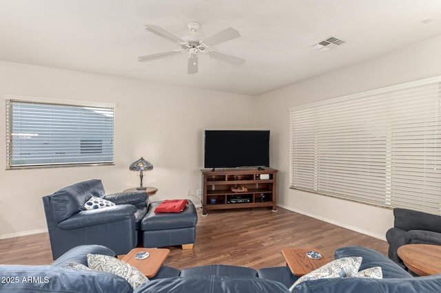 living room featuring dark hardwood / wood-style floors and ceiling fan