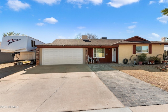 ranch-style house featuring a garage