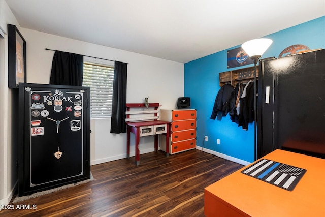 bedroom with dark hardwood / wood-style floors