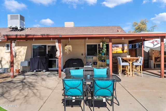 back of house featuring a patio and central air condition unit