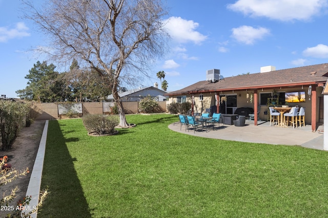 view of yard with a patio and central air condition unit