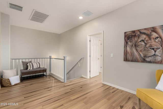 sitting room featuring light wood-type flooring