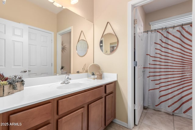 bathroom with tile patterned flooring and vanity