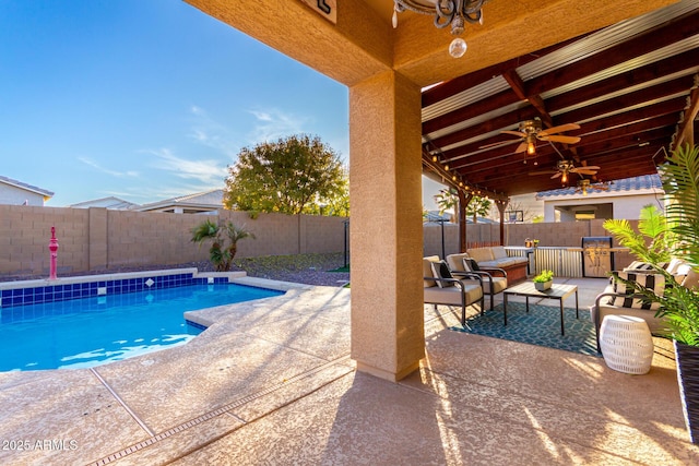 view of swimming pool with an outdoor hangout area, ceiling fan, and a patio area