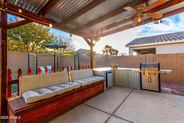 view of patio featuring ceiling fan, an outdoor hangout area, and grilling area