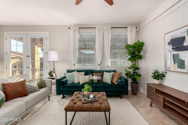 tiled living room with french doors and ceiling fan