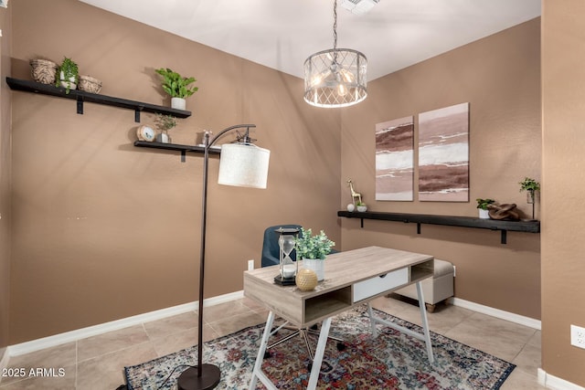 office featuring a notable chandelier and light tile patterned flooring