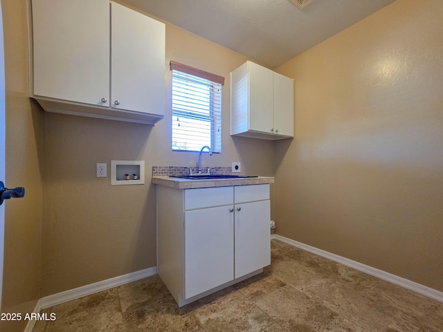 laundry area featuring baseboards, cabinet space, a sink, washer hookup, and hookup for an electric dryer