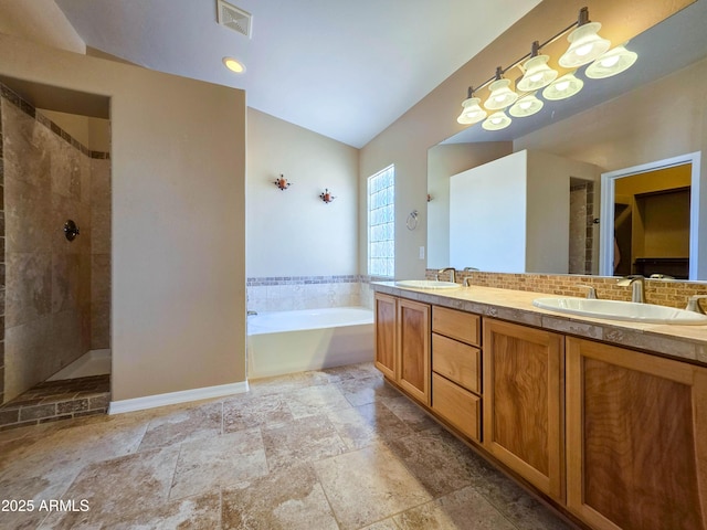 full bathroom featuring visible vents, a tile shower, a sink, and a garden tub
