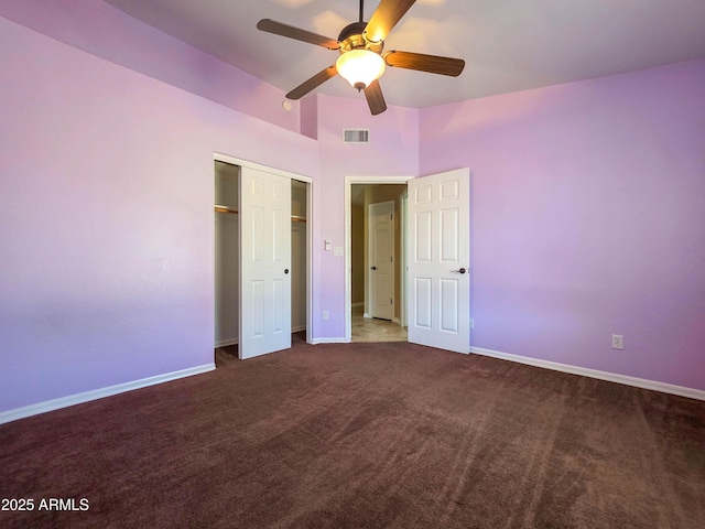 unfurnished bedroom featuring visible vents, baseboards, carpet floors, and a closet