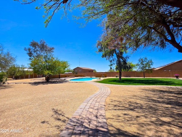 view of yard with a fenced backyard and a fenced in pool