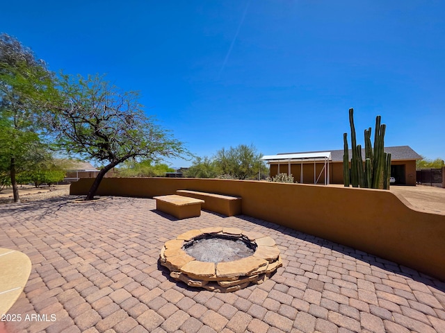 view of patio / terrace featuring a fire pit
