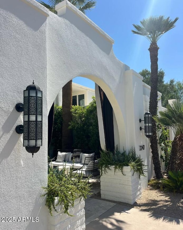 view of side of property featuring stucco siding