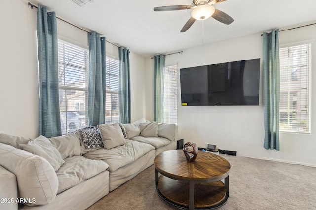 carpeted living room featuring ceiling fan