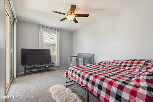 bedroom featuring light colored carpet and ceiling fan