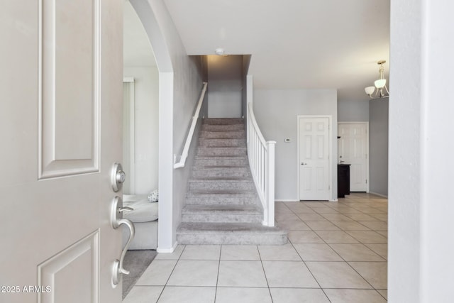 stairs with tile patterned floors