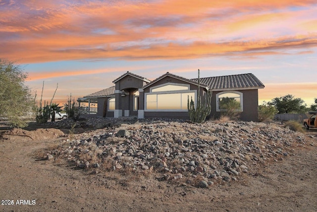 8343 W Calle Lejos, Peoria, AZ 85383 - view of front of home featuring a tile roof and stucco siding