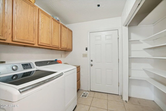 8343 W Calle Lejos, Peoria, AZ 85383 - laundry room with cabinet space, separate washer and dryer, and light tile patterned floors