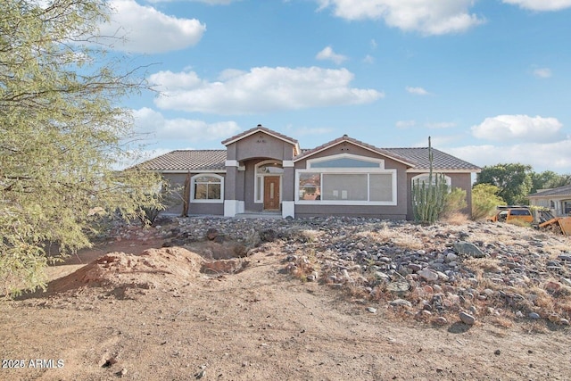 8343 W Calle Lejos, Peoria, AZ 85383 - view of front of home featuring a tile roof and stucco siding